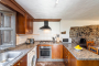 The kitchen / dining area has lowish ceilings